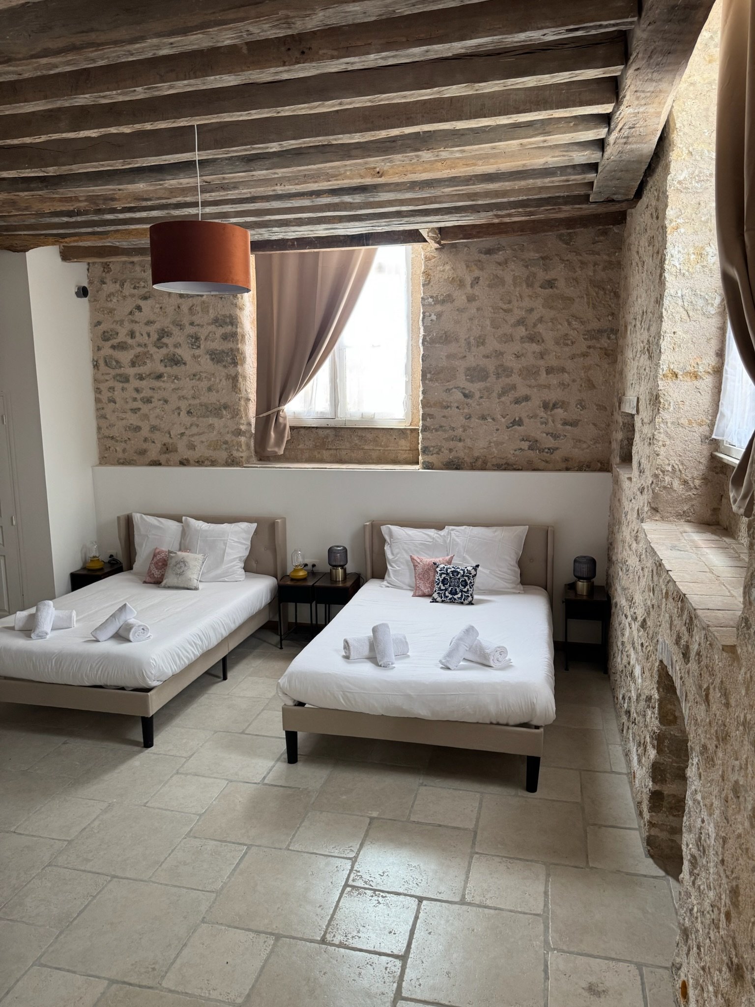 Guest room - twin beds, stone walls
