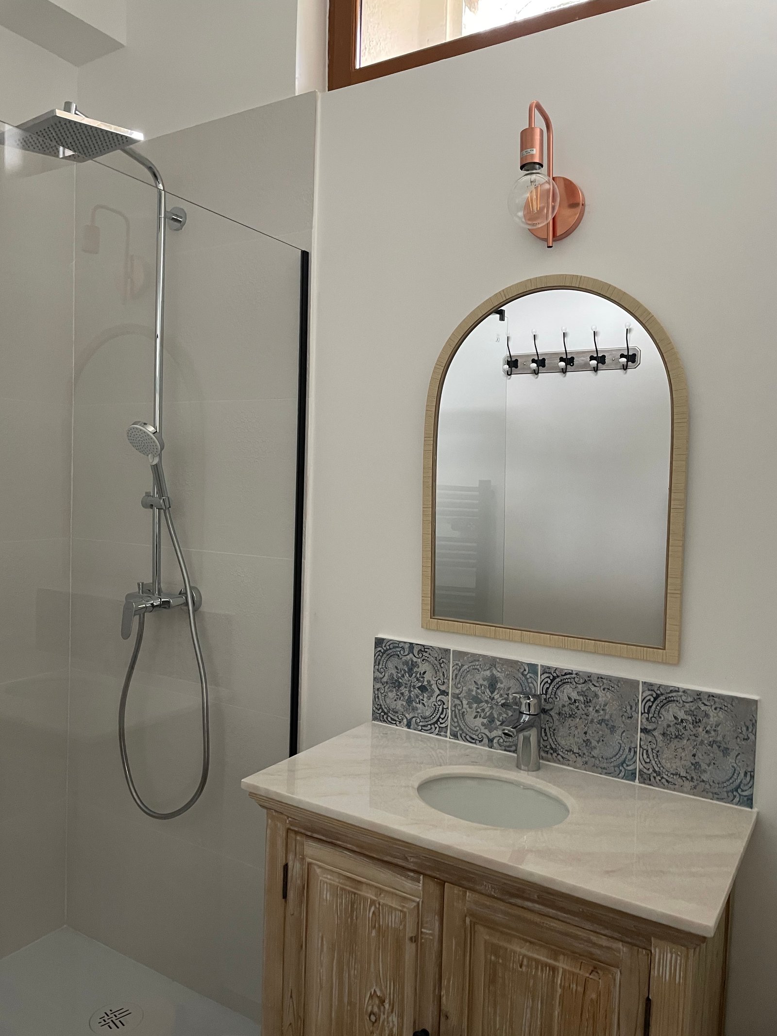 Bathroom - basin and arch mirror